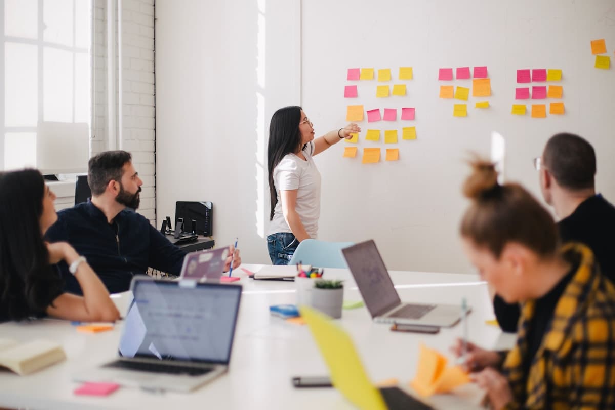 Team collaborating around a table in a workshop